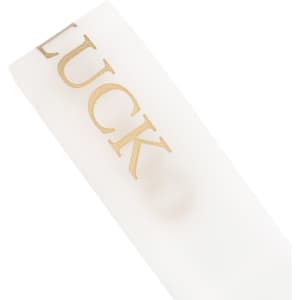 A soft white ribbon with gold text, featuring a logo or branding on the surface.
