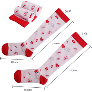 Compression socks in white with red accents, featuring medical-themed patterns. Two pairs are folded beside them.