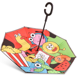 A reversible folding umbrella features a vibrant design with cartoonish fruits, snacks, and playful characters in various colours.