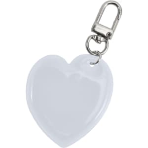 A heart-shaped reflective keychain in white with a metal clip for attachments.