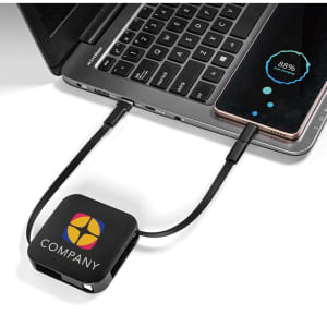 A black 60W 4-in-1 retractable charging cable connected to a laptop, featuring a logo.