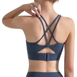 A women's navy cross back yoga crop bra tank with multi-strapped back design and adjustable closure.