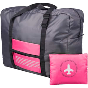A grey travel bag with pink accents and a matching pink pouch. The bag features a front pocket and carry handles.