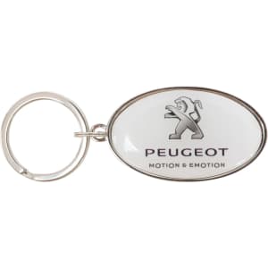 A silver oval keyring with a domed epoxy surface, featuring a logo and text on a white background.
