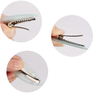 A teardrop-shaped iridescent alligator hair clip in light blue, shown from multiple angles, with a silver clip mechanism.
