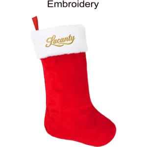 A red Christmas stocking with a white fur cuff and gold embroidery. It features a logo on the cuff.