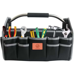 A black tool carrier bag with multiple compartments, filled with various tools including pliers, screwdrivers, and a wrench.
