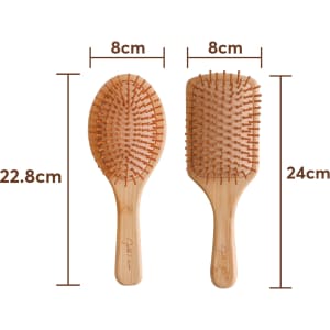 A bamboo hair brush featuring an oval and rectangular design, with wooden bristles and a natural finish.