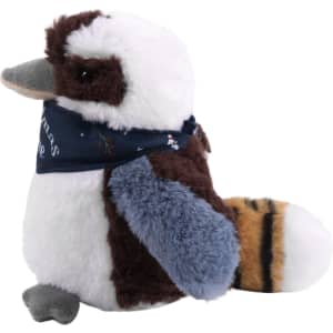 A Kookaburra plush toy in brown, white, and blue, wearing a dark blue bandana. It has a rounded shape and soft texture.