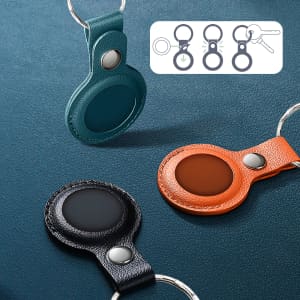 PU leather AirTag holders in teal, black, and orange, each with a keyring and a metallic snap button.