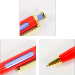 A rocket-shaped pen in red with a gold clip and blue accents. It features a branding logo and a unique spin message.