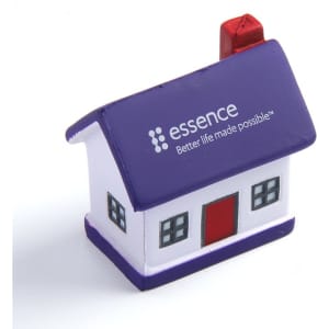 A purple and white house-shaped stress reliever with a red door and a chimney, featuring a logo.