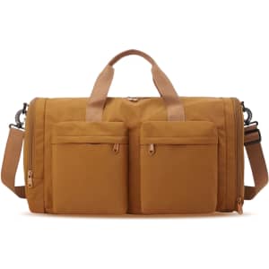 A foldable travel duffle bag in a warm mustard colour with two front pockets and adjustable strap.