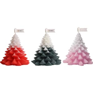 Christmas tree-shaped candles in red, green, and pink colours, featuring a small flag on top of each.