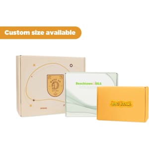 Three product boxes in various colours: a brown box with a logo, a clear box, and an orange box with branding.