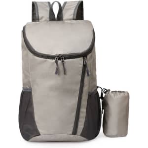 A packable travel backpack in grey with black accents and a small detachable pouch. It has a logo on it.