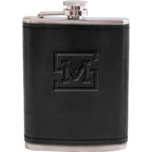 A drink bottle featuring a black leather exterior and a silver metal top, engraved with a logo.