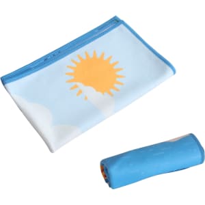 A microfibre beach towel in light blue with a sun graphic, rolled and folded for easy storage.