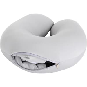 A grey, U-shaped travel pillow featuring a zippered compartment for easy storage and portability.