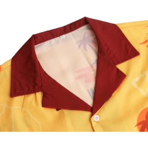 A yellow Cuban collar shirt with a maroon collar, featuring a tropical pattern and button placket.