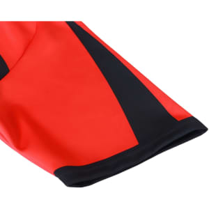 A red and black crew neck raglan sport tee shirt with a micro mesh design and a logo.