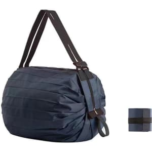 A foldable reusable shopping shoulder bag in navy blue, featuring a black strap and a compact folded design.