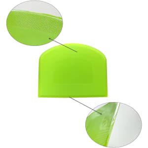 A flexible bowl scraper in bright green, featuring a textured edge and a smooth surface. Includes a logo or branding.