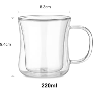 A double wall glass mug with a transparent design, measuring 9.4 cm in height and 8.3 cm in diameter.