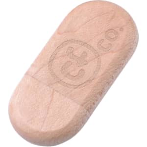 An oblong wooden flash drive in light wood tone with a logo engraved on the surface.