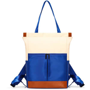 A convertible backpack to tote bag in cream and blue, featuring shoulder straps and a front zip pocket.