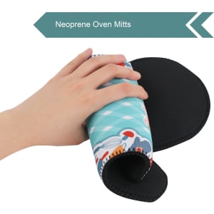 A neoprene oven mitt featuring a colourful design and a textured black grip on the underside is being held by a hand.