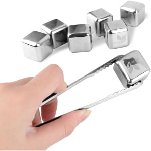 Stainless steel ice cubes and tongs, featuring six shiny silver cubes in a simple arrangement.