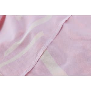 A pink micro mesh long sleeves shirt featuring a subtle pattern, with visible stitching along the edges.