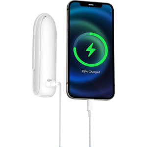 A white USB handheld mini fan with a flashlight is connected to a charging smartphone displaying a battery icon.