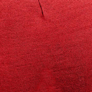 A red textured fabric featuring a knitted pattern, suitable for making beanies. The image includes a branding logo.