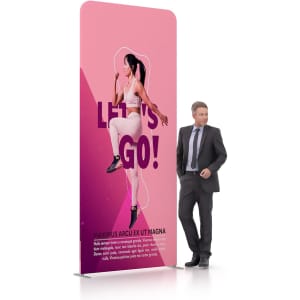 A pink tension fabric display wall featuring a figure in a dynamic pose, with a man in a suit standing beside it.