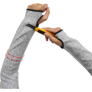 Cut resistant sleeves in grey, featuring reinforced areas for added protection, with a person's arm holding a utility knife.