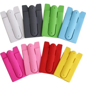 A collection of Smart Wallet Stands in various colours: white, grey, green, blue, pink, red, and yellow, all with minimalist designs.
