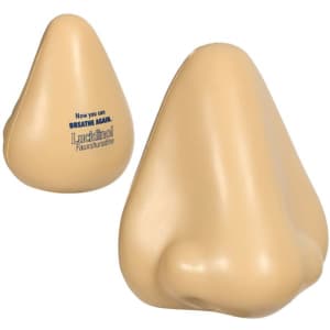 A beige stress reliever shaped like a large nose, featuring a logo on one side.