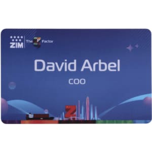 A custom PVC name badge in blue with a branding logo, featuring a design and text for an individual's name and title.