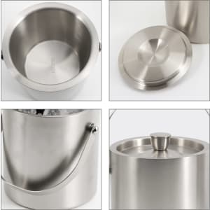 A stainless steel ice bucket with a lid and handle, featuring a smooth finish and a sleek design.
