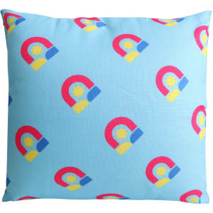 A square cushion featuring a blue background with multicoloured magnet prints and a logo.