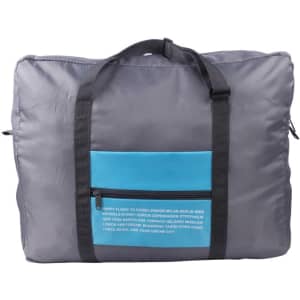 A grey travel compressed bag featuring a blue front pocket and black straps, with a logo on the side.