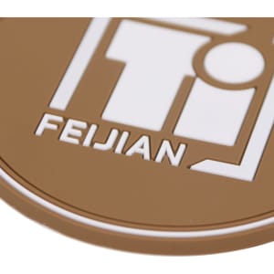 A brown custom PVC coaster featuring a white logo design with text and a circular shape.