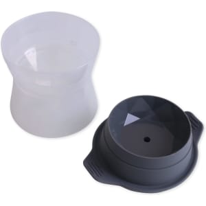 A black whisky ice ball mould next to a transparent silicone ice mould, both designed for creating ice spheres.