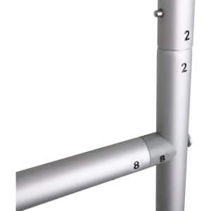 A metallic dispenser stand featuring silver pipes with numbered markings.