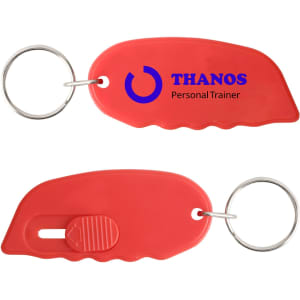 A red mini cutter keyring with a silver keyring attachment and a logo.