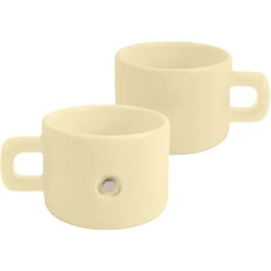 A cream-coloured ceramic mug with a magnetic feature and a handle, showcasing a sleek, minimalist design.
