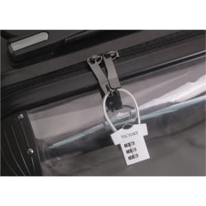 A silver metal coded lock attached to a black zipper on a transparent bag, featuring a logo.