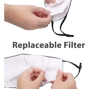 A reusable face mask with black edges and a replaceable filter, held by hands for demonstration.